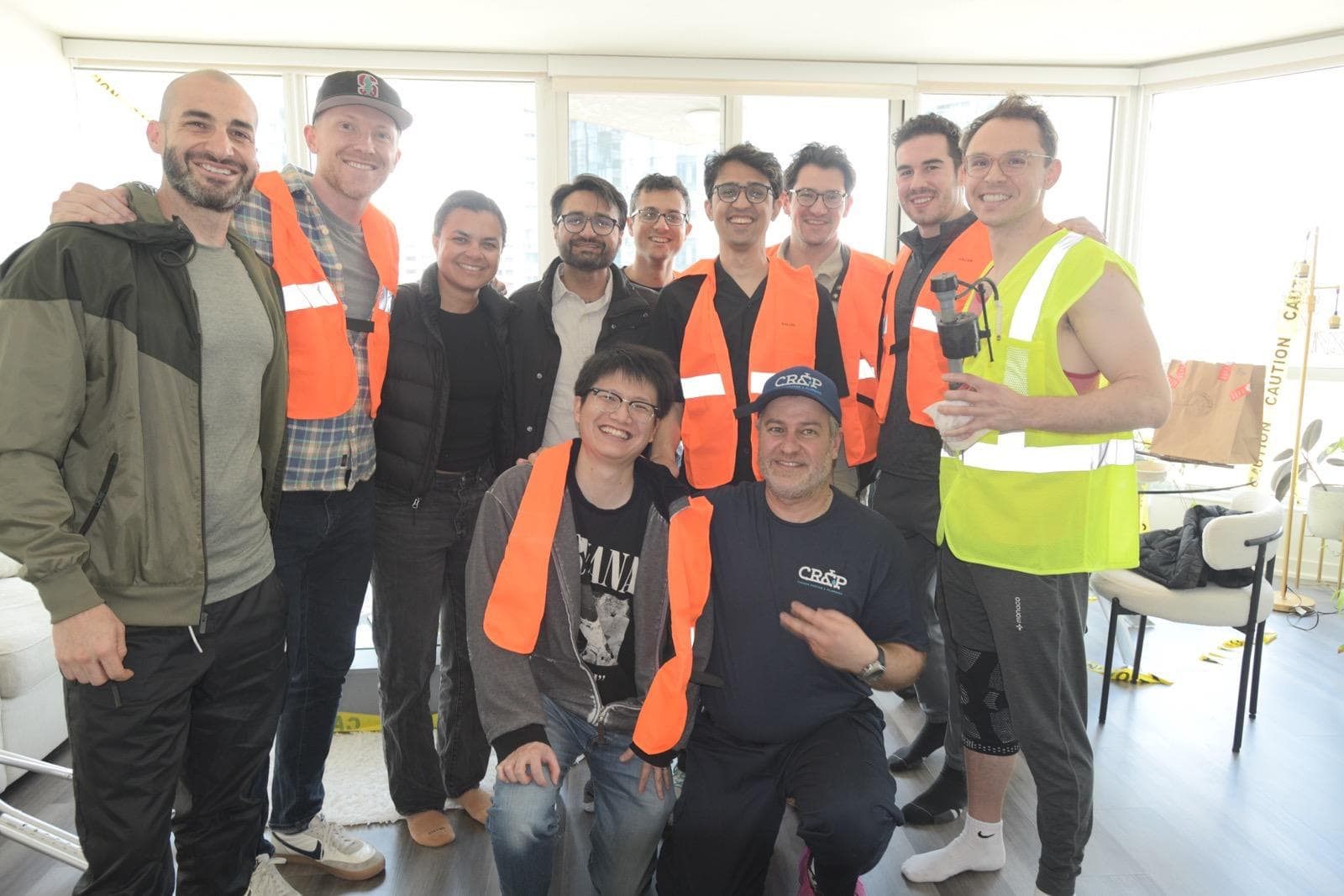 A group of friends learning plumbing from a pro